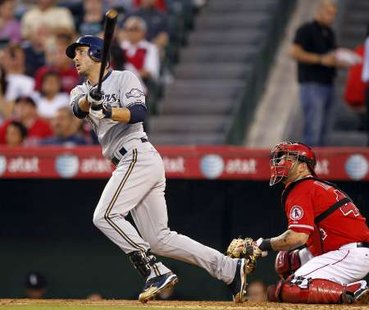 Milwaukee Brewers' Ryan Braun follows through to hit a grand slam home run as the Los Angeles Angels catcher Mike Napoli (R) also watches in the third inning of their MLB interleague baseball game in Anaheim, California June 14, 2010. REUTERS Milwaukee Brewers' Ryan Braun follows through to hit a grand slam home run as the Los Angeles Angels catcher Mike Napoli (R) also watches in the third inning of their MLB interleague baseball game in Anaheim, California June 14, 2010. REUTERS