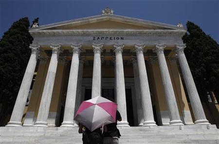 Tourists stand in front of Zappeion mansion in Athens Tourists stand in front of Zappeion mansion in Athens