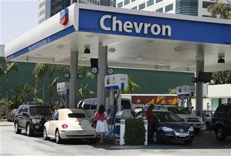 Motorists are shown at gas pumps at a Chevron gasoline station in Burbank Motorists are shown at gas pumps at a Chevron gasoline station in Burbank
