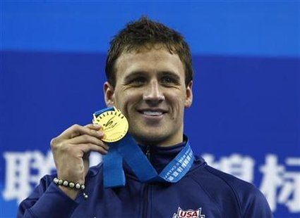 Lochte of the U.S. poses with his gold medal for the men's 200m backstroke final at the 14th FINA World Championships in Shanghai Lochte of the U.S. poses with his gold medal for the men's 200m backstroke final at the 14th FINA World Championships in Shanghai