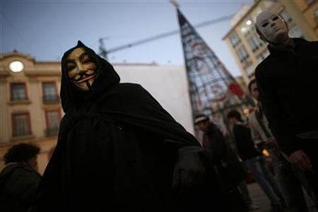 WikiLeaks supporters wear masks during a demonstration in Malaga WikiLeaks supporters wear masks during a demonstration in Malaga