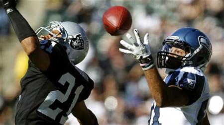 Oakland Raiders Nnamdi Asomugha breaks up a pass intended for Seattle Seahawks Golden Tate during their NFL football game in Oakland Oakland Raiders Nnamdi Asomugha breaks up a pass intended for Seattle Seahawks Golden Tate during their NFL football game in Oakland