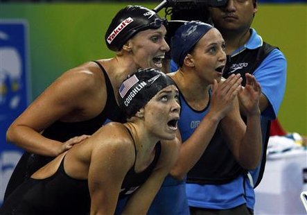 Coughlin, Vollmer and Soni cheer on their teammate Franklin during women's 4 X 100m medley relay final at 14th FINA World Championships in S Coughlin, Vollmer and Soni cheer on their teammate Franklin during women's 4 X 100m medley relay final at 14th FINA World Championships in S