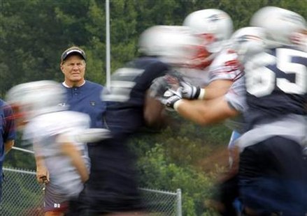 New England Patriots head coach Bill Belichick watches a drill during the afternoon practice session of their NFL training camp in Foxboroug New England Patriots head coach Bill Belichick watches a drill during the afternoon practice session of their NFL training camp in Foxboroug