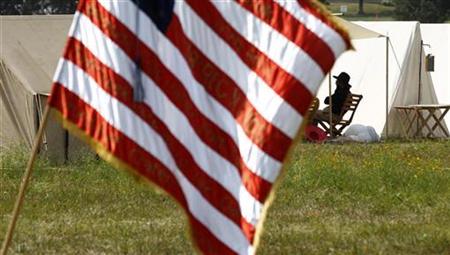 A Civil War re-enactor sits in the shade of his tent in the Union Army Camp to avoid the blistering heat in Manassas A Civil War re-enactor sits in the shade of his tent in the Union Army Camp to avoid the blistering heat in Manassas