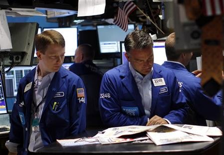 Traders work on the main trading floor of the New York Stock Exchange in New York Traders work on the main trading floor of the New York Stock Exchange in New York