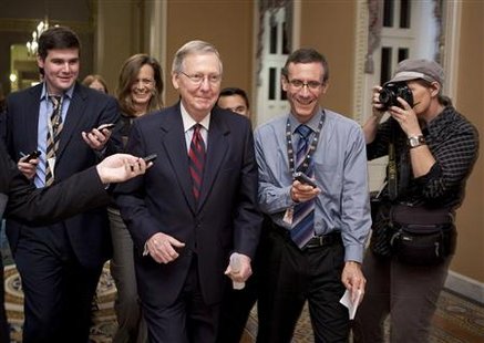 US Senate Minority Leader McConnell walks to the Senate Chamber after a tentative agreement had been reached on the debt ceiling crises on C US Senate Minority Leader McConnell walks to the Senate Chamber after a tentative agreement had been reached on the debt ceiling crises on C