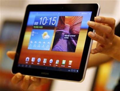 A model holds a Samsung Electronics' new tablet 'Galaxy Tab 10.1' during its launch ceremony at the firm's headquarters in Seoul A model holds a Samsung Electronics' new tablet 'Galaxy Tab 10.1' during its launch ceremony at the firm's headquarters in Seoul
