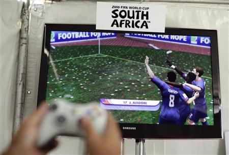 A person plays the EA Sports 2010 FIFA World Cup South Africa video game in Los Angeles A person plays the EA Sports 2010 FIFA World Cup South Africa video game in Los Angeles