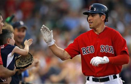 Boston Red Sox Ellsbury high fives a young fan after hitting a home run against the Seattle Mariners in their MLB game in Boston Boston Red Sox Ellsbury high fives a young fan after hitting a home run against the Seattle Mariners in their MLB game in Boston