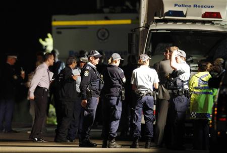 Police and emergency workers stand near a house where bomb squad officers are working in Mosman Police and emergency workers stand near a house where bomb squad officers are working in Mosman