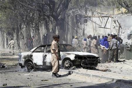A view of the scene after a car bomb detonated along a street in Somalia's capital Mogadishu A view of the scene after a car bomb detonated along a street in Somalia's capital Mogadishu