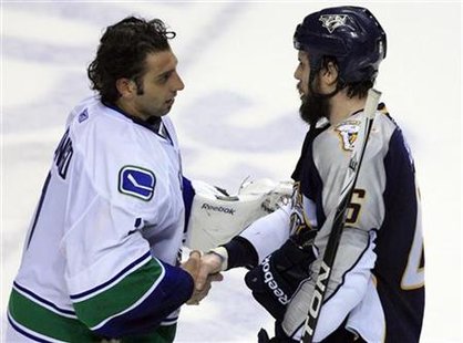 Nashville Predators defenseman Shea Weber shakes hands with Vancouver Canucks goalie Roberto Luongo after losing following Game 6 of the NHL Nashville Predators defenseman Shea Weber shakes hands with Vancouver Canucks goalie Roberto Luongo after losing following Game 6 of the NHL