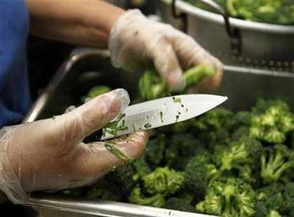 A worker prepares some of the more than 8,000lbs of locally grown broccoli from a partnership between Farm to School and Healthy School Meal A worker prepares some of the more than 8,000lbs of locally grown broccoli from a partnership between Farm to School and Healthy School Meal