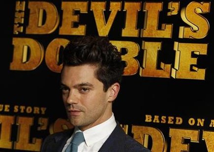 Actor Dominic Cooper poses for photographers at the British Premiere of "The Devil's Double", in London Actor Dominic Cooper poses for photographers at the British Premiere of "The Devil's Double", in London