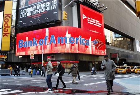 Pedestrians walk past a Bank of America sign on a building in Times Square in New York Pedestrians walk past a Bank of America sign on a building in Times Square in New York