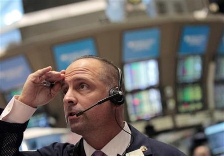 A trader looks on as he works on the floor of the New York Stock Exchange A trader looks on as he works on the floor of the New York Stock Exchange