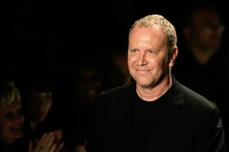 Designer Michael Kors smiles on the runway during New York fashion week Designer Michael Kors smiles on the runway during New York fashion week