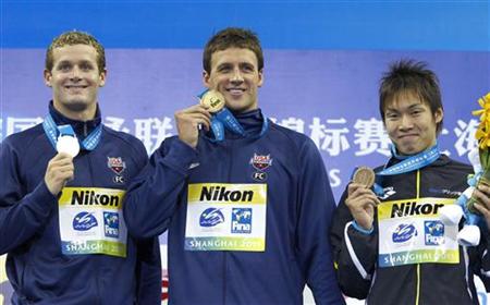 Lochte and Clary and Horihata display their medals during an award ceremony after men's 400m individual medley final at 14th FINA World Cham Lochte and Clary and Horihata display their medals during an award ceremony after men's 400m individual medley final at 14th FINA World Cham