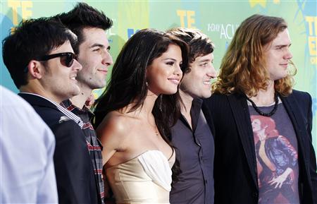 Actress Selena Gomez poses with her band "The Scene" at the Teen Choice Awards in Los Angeles Actress Selena Gomez poses with her band "The Scene" at the Teen Choice Awards in Los Angeles