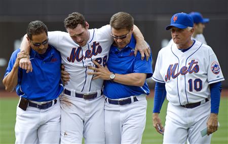 New York Mets Terry Collins reacts as Daniel Murphy is helped off the field by trainers Ray Ramirez and Mike Herbst in New York New York Mets Terry Collins reacts as Daniel Murphy is helped off the field by trainers Ray Ramirez and Mike Herbst in New York