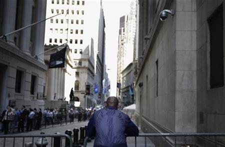 A trader stands outside the New York Stock Exchange following the end of the trading day A trader stands outside the New York Stock Exchange following the end of the trading day