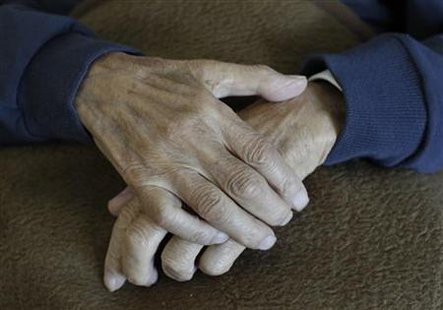 The hands of a pensioner are pictured during an afternoon nap at residential home in Eichenau The hands of a pensioner are pictured during an afternoon nap at residential home in Eichenau