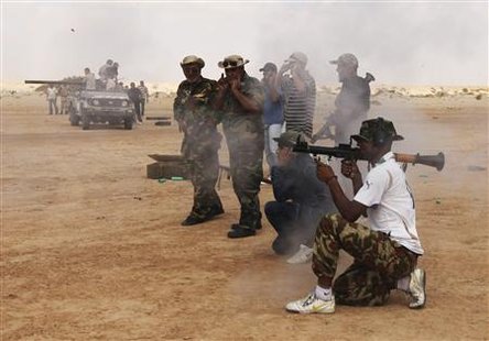 Rebel fighter fires RPG during training in Geminis Rebel fighter fires RPG during training in Geminis