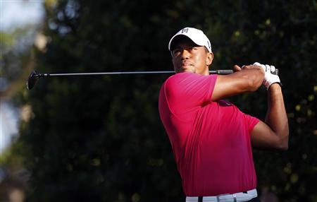 Tiger Woods of the U.S. tees off on the 11th hole during the first round of the 93rd PGA Championship golf tournament at the Atlanta Athleti Tiger Woods of the U.S. tees off on the 11th hole during the first round of the 93rd PGA Championship golf tournament at the Atlanta Athleti