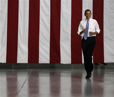 U.S. President Barack Obama walks at battery facility Johnson Controls, Inc., in Holland, Michigan U.S. President Barack Obama walks at battery facility Johnson Controls, Inc., in Holland, Michigan