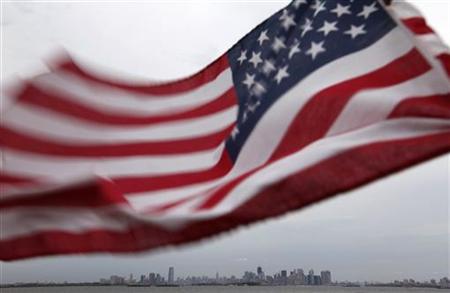A U.S. flag flutters over top of the skyline of New York and Jersey City, as seen from Bayonne A U.S. flag flutters over top of the skyline of New York and Jersey City, as seen from Bayonne