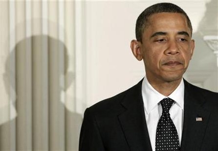 U.S. President Barack Obama pauses as he speaks at an iftar dinner celebrating Ramadan at the White House in Washington
