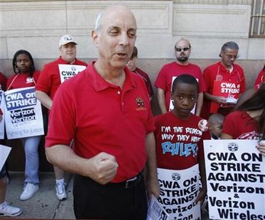 Communications Workers of America President Cohen speaks with Verizon workers while they picket at the Verizon office in Philadelphia