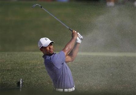 Tiger Woods of the U.S. hits from a bunker on the 13th hole during the second round of the 93rd PGA Championship golf tournament at the Atla Tiger Woods of the U.S. hits from a bunker on the 13th hole during the second round of the 93rd PGA Championship golf tournament at the Atla