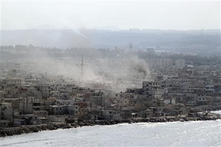 Smoke rises in the city of Latakia Smoke rises in the city of Latakia