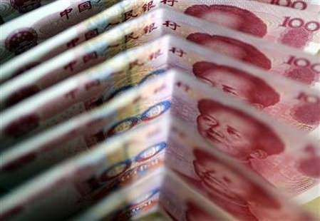 One-hundred Yuan notes are seen in this picture illustration in Beijing One-hundred Yuan notes are seen in this picture illustration in Beijing