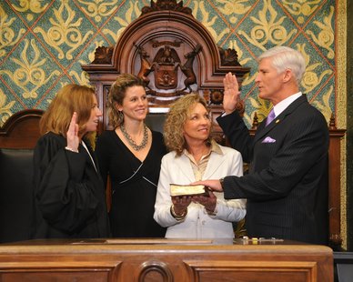 State Rep. Dave Agema (R-Grandville) is sworn in by Michigan Supreme Court Justice Mary Beth Kelly (R) on Jan. 12, 2011, with Agema's wife and daughter looking on. (photo courtesy Michigan House Republicans) State Rep. Dave Agema (R-Grandville) is sworn in by Michigan Supreme Court Justice Mary Beth Kelly (R) on Jan. 12, 2011, with Agema's wife and daughter looking on. (photo courtesy Michigan House Republicans)