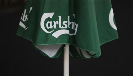 A Carlsberg logo is seen on a parasol outside a pub in central London A Carlsberg logo is seen on a parasol outside a pub in central London
