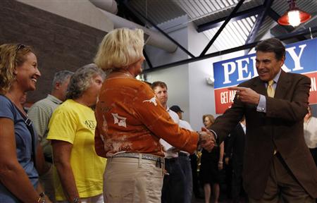 Republican presidential candidate Texas Governor Rick Perry greets people during a campaign stop in Walcott, Iowa Republican presidential candidate Texas Governor Rick Perry greets people during a campaign stop in Walcott, Iowa