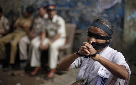 A social activist participates in a protest rally against corruption in Mumbai A social activist participates in a protest rally against corruption in Mumbai