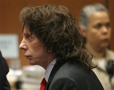 Music producer Phil Spector stands in court after he was convicted of second-degree murder in Los Angeles
