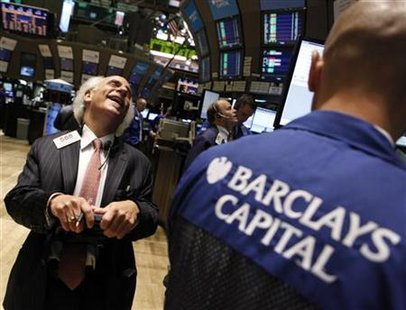 Trader Peter Tuchman shares a laugh with a specialist trader from Barclays Capital on the floor of the New York Stock Exchange Trader Peter Tuchman shares a laugh with a specialist trader from Barclays Capital on the floor of the New York Stock Exchange