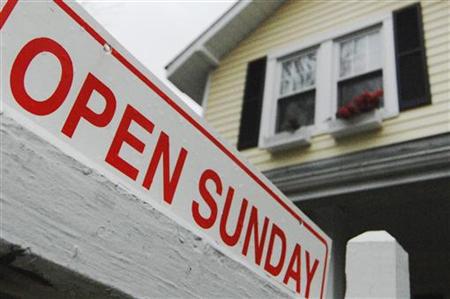 A sign advertises an open house for sale in Alexandria, Virginia A sign advertises an open house for sale in Alexandria, Virginia