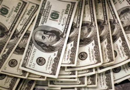 Four thousand U.S. dollars are counted out by a banker at a bank in Westminster Four thousand U.S. dollars are counted out by a banker at a bank in Westminster