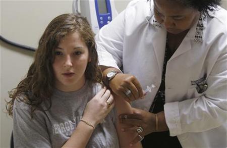 Student gets a H1N1 flu vaccine shot in Washington Student gets a H1N1 flu vaccine shot in Washington