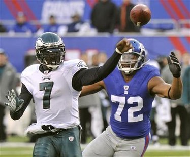 Philadelphia Eagles Vick passes before New York Giants Umenyiora reaches him in East Rutherford Philadelphia Eagles Vick passes before New York Giants Umenyiora reaches him in East Rutherford