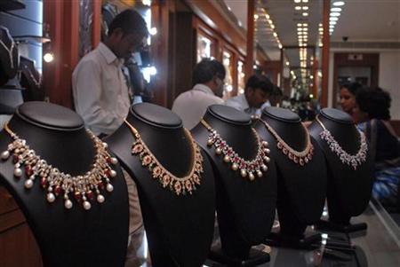 Salesmen at jewellery shop attend to their customers in Hyderabad Salesmen at jewellery shop attend to their customers in Hyderabad