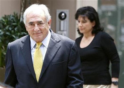 Former International Monetary Fund chief Dominique Strauss-Kahn and his wife Anne Sinclair leave their temporary Manhattan residence in New Former International Monetary Fund chief Dominique Strauss-Kahn and his wife Anne Sinclair leave their temporary Manhattan residence in New