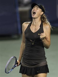 Maria Sharapova of Russia reacts after winning fifth game in the third set against Vera Zvonareva of Russia during their semi-final round ma Maria Sharapova of Russia reacts after winning fifth game in the third set against Vera Zvonareva of Russia during their semi-final round ma