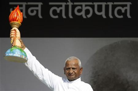 Anna Hazare displays a mock torch to his supporters on the fourth day of his fasting at Ramlila grounds in New Delhi Anna Hazare displays a mock torch to his supporters on the fourth day of his fasting at Ramlila grounds in New Delhi